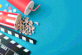 image d'un clap de cinema, du popcorn et un soda
